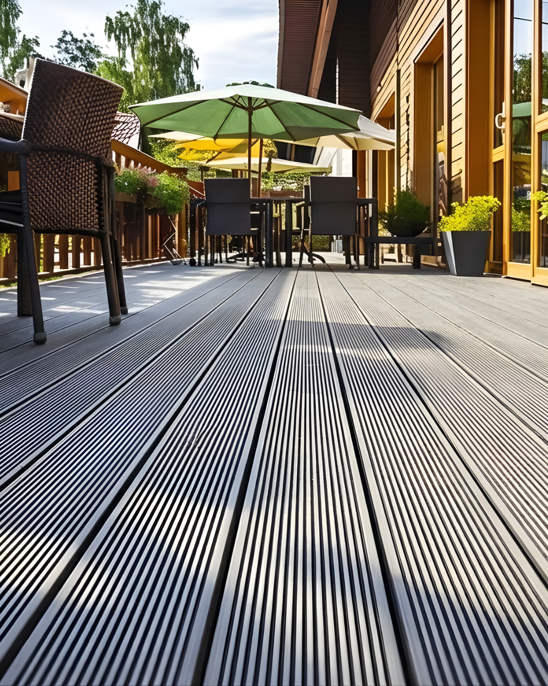 Outdoor patio with Outdoor WPC Floor Decking, chairs, and umbrellas in a residential setting.