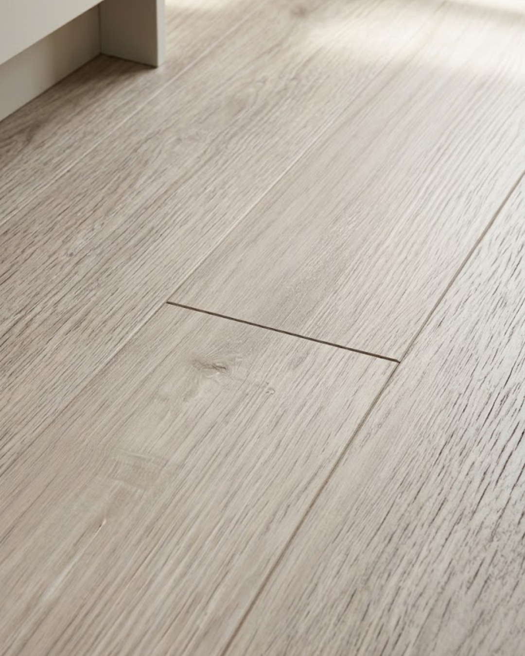 Natural wood look Castle Oak SPC flooring installed indoors