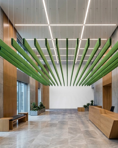A modern, high-Acoustic Baffle ceiling panels lobby interior with a reception desk, wood-paneled walls, stone flooring, and distinctive green suspended ceiling panels radiating from the center.