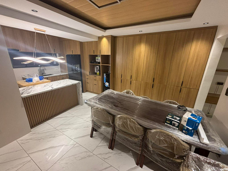 Modern kitchen with wooden cabinets and marble countertops By Wood Panel Philippines
