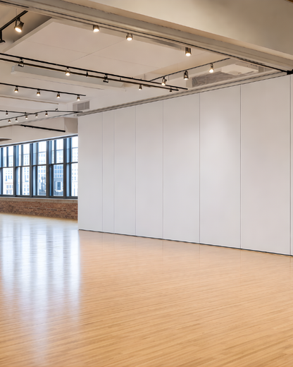 Modern room with white walls, wooden floor, and ceiling lights Soundproof Wall Partition