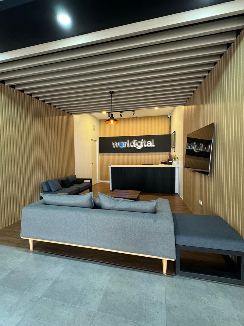 Modern office interior with a reception desk and 'Worlddigital' sign  By Wood Panel Philippines